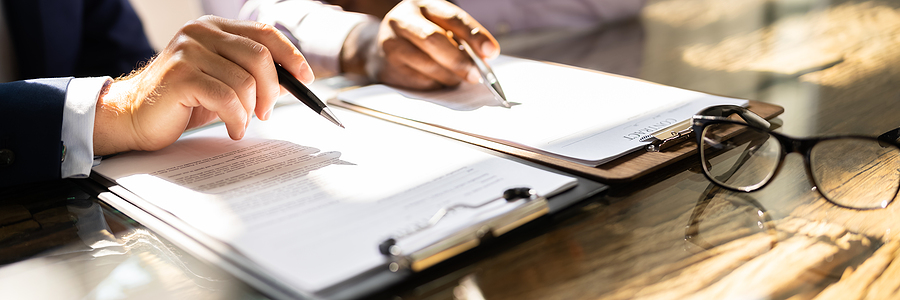 Business professionals discussing the often-overlooked importance of leases, highlighting their impact on business operations and value.